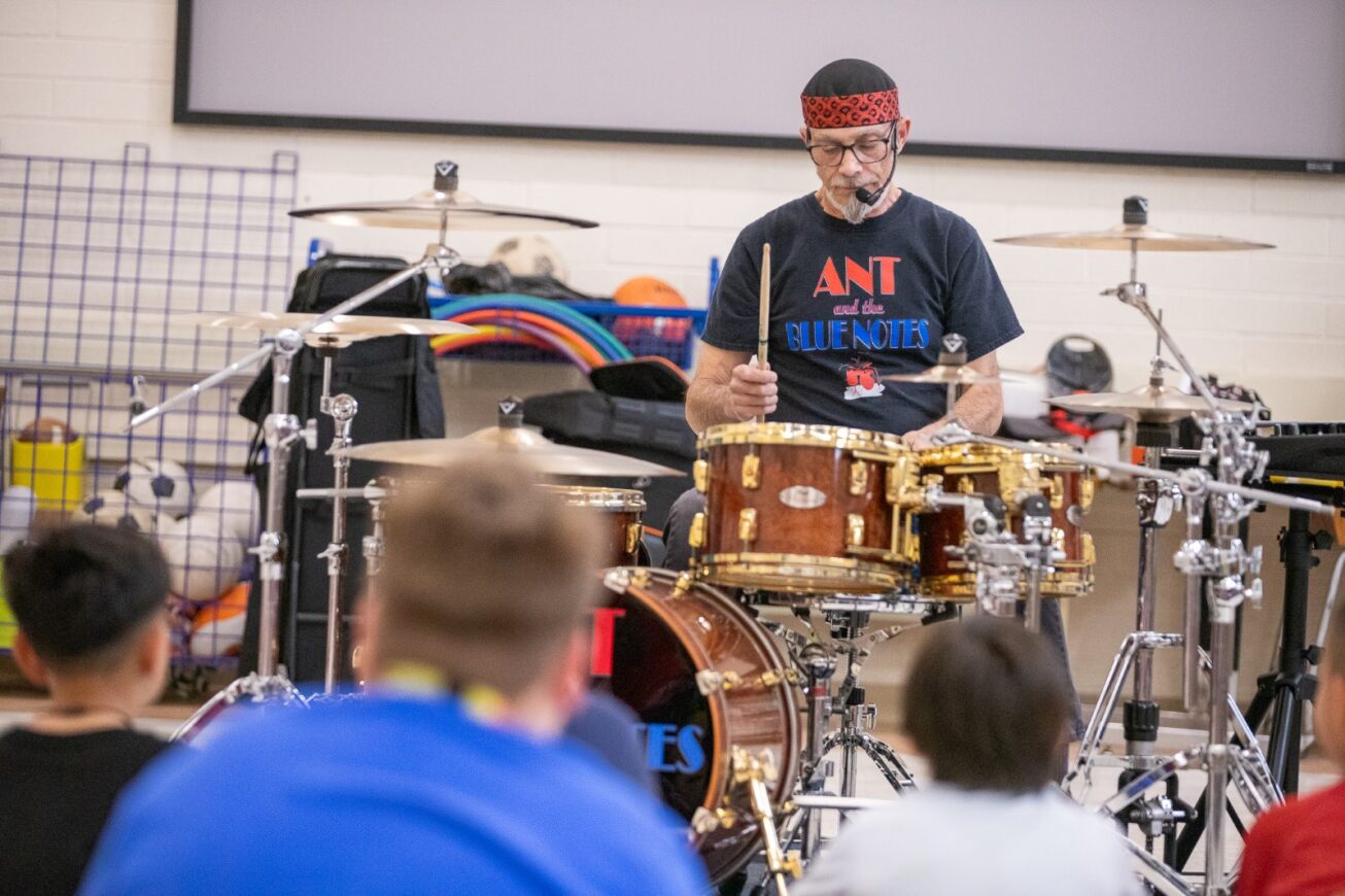A professional drummer performs for Wright students