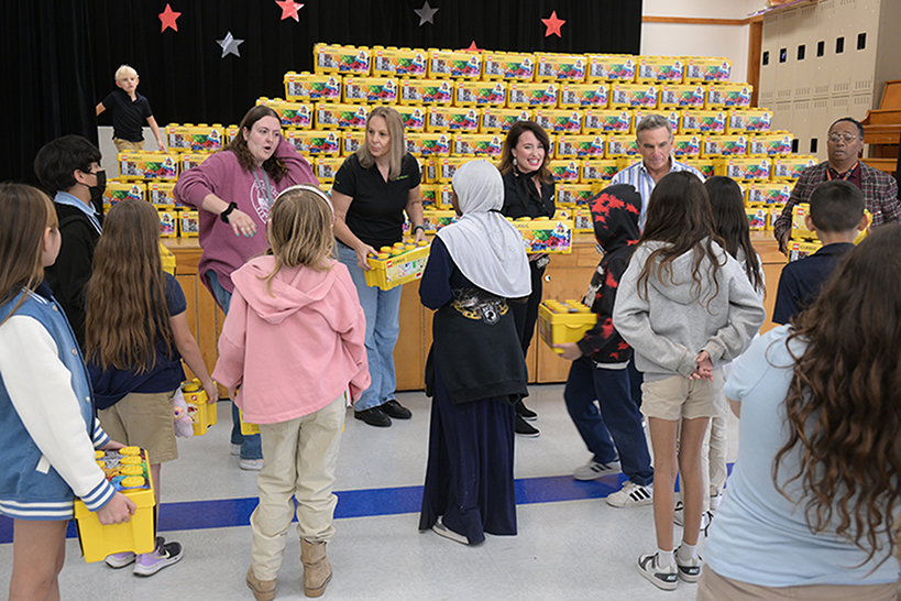 Students line up to get their Lego kit