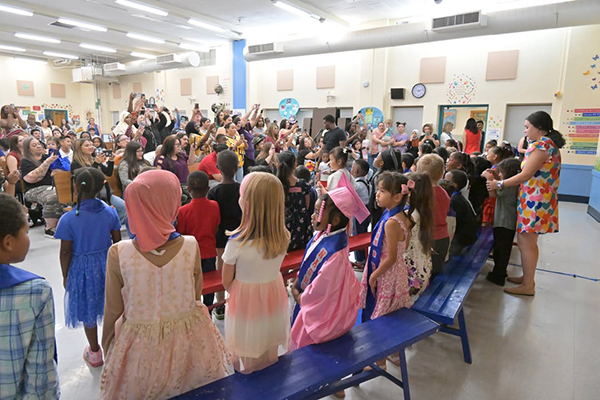 Students face their families during the kinder promotion ceremony